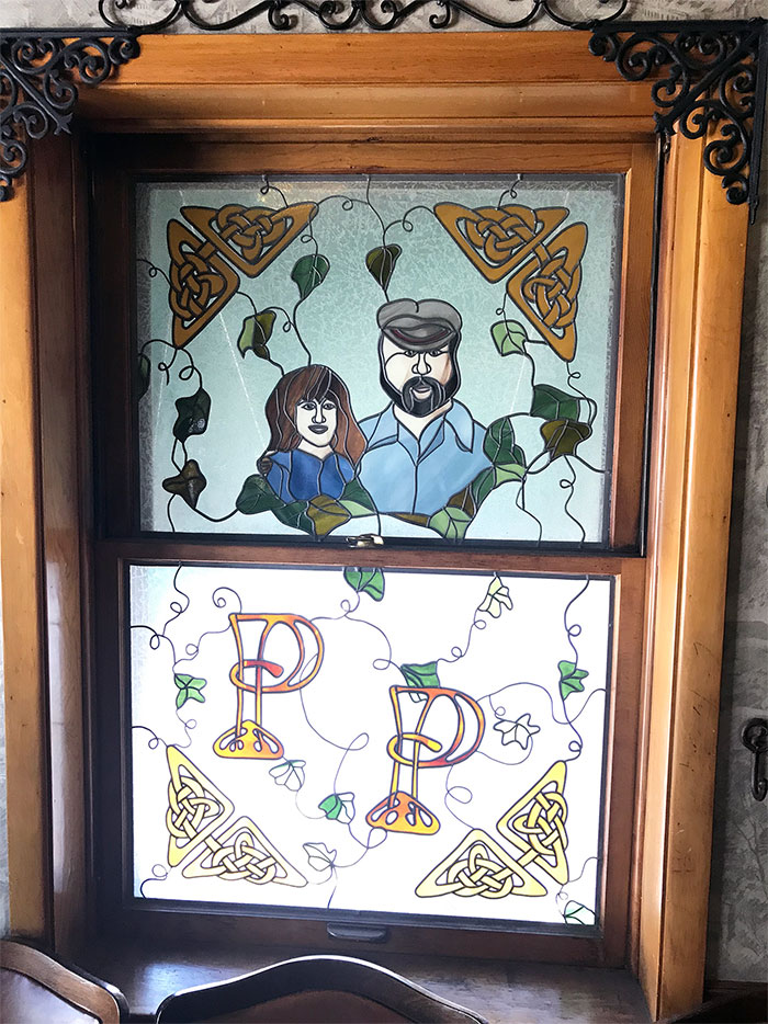 Paddy's Pub stained glass with Patty and Woody